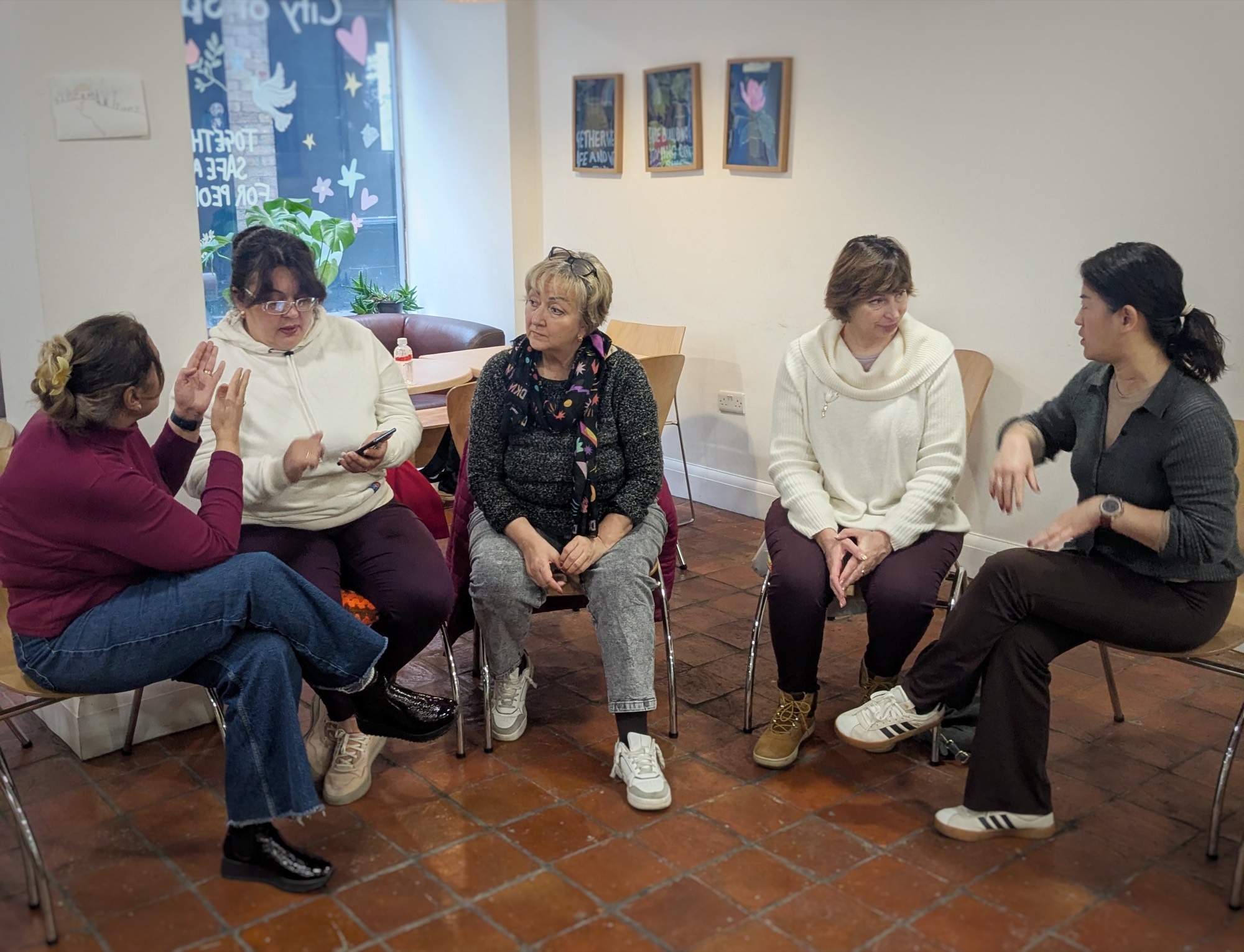 A group of women in conversation during a workshop